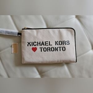 Michael Kors Toronto Medium Canvis Clutch.